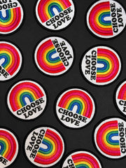 Patches with rainbow designs and 'Choose Love' text on a black background