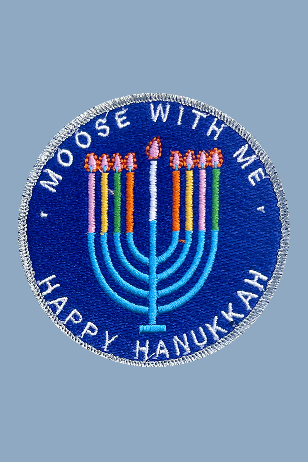 Circular patch with 'Moose with Me' and 'Happy Hanukkah' text on a blue background
