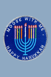 Circular patch with 'Moose with Me' and 'Happy Hanukkah' text on a blue background