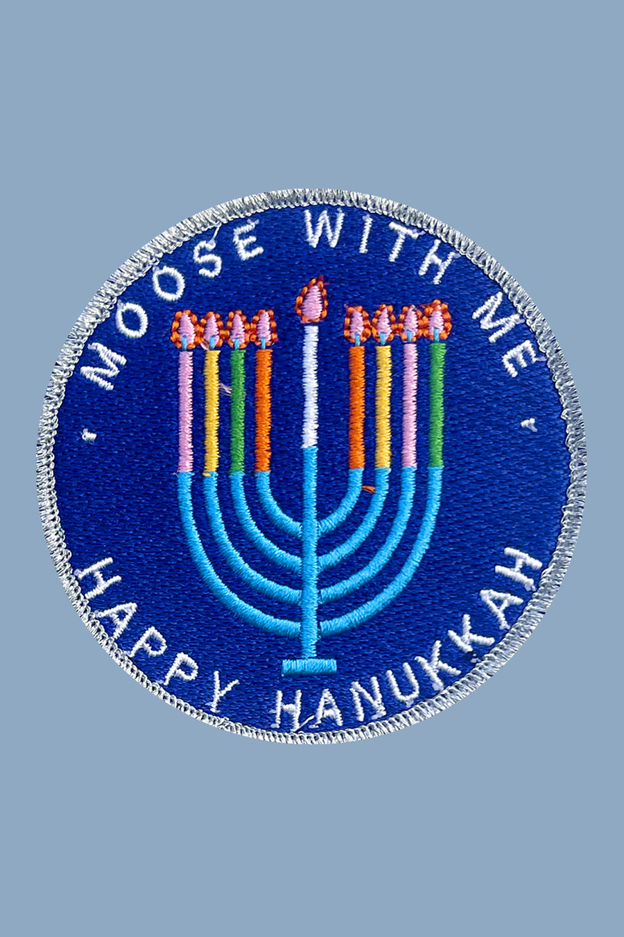 Circular patch with 'Moose with Me' and 'Happy Hanukkah' text on a blue background