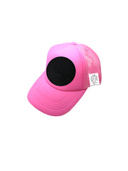 Pink cap with a black circle on a white background