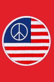 Patch with peace symbol and American flag design on a red background