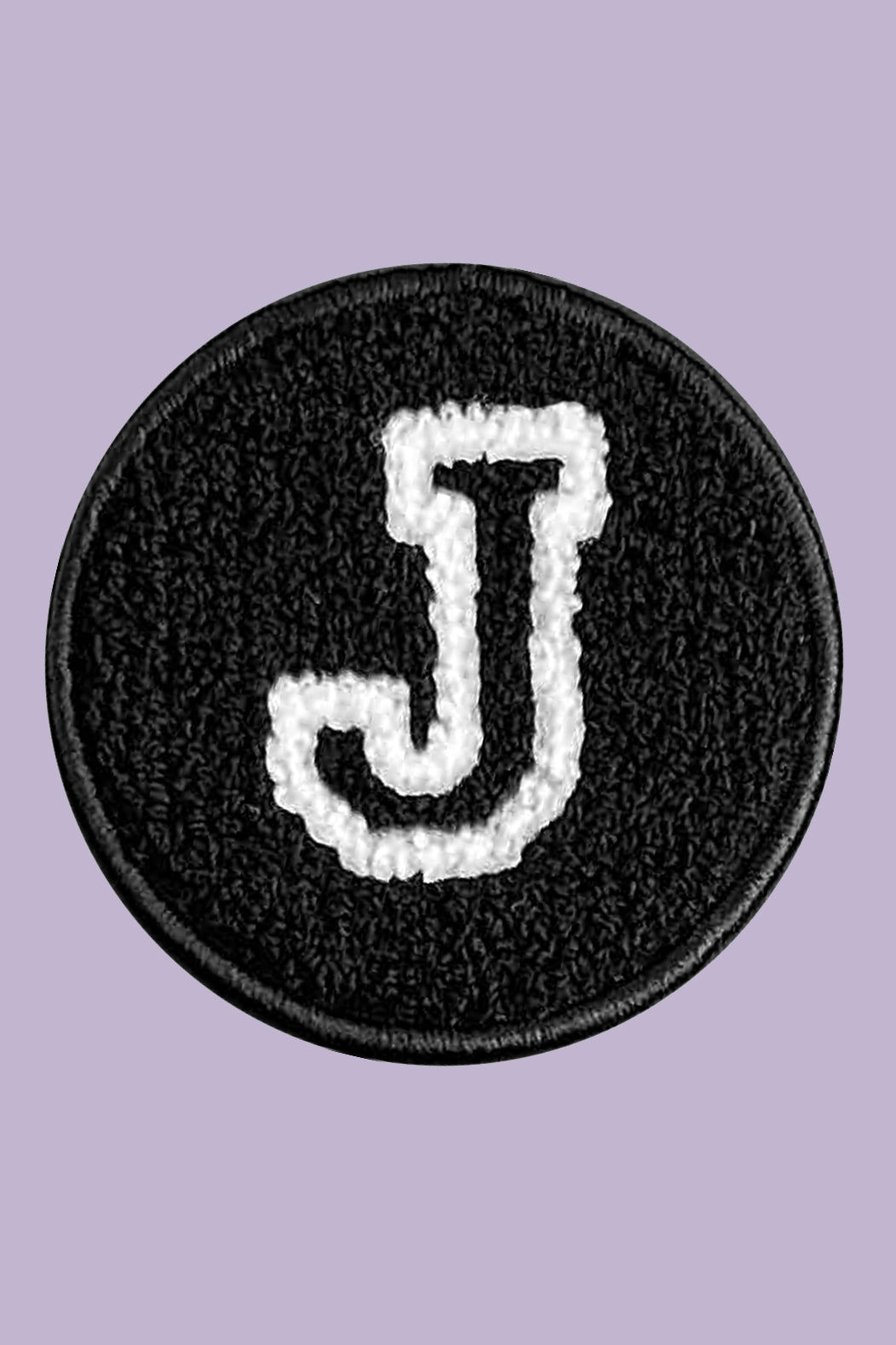 Black patch with white letter 'J' on a purple background