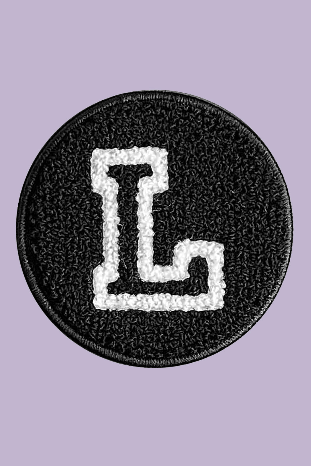 Black patch with a white letter 'L' on a purple background