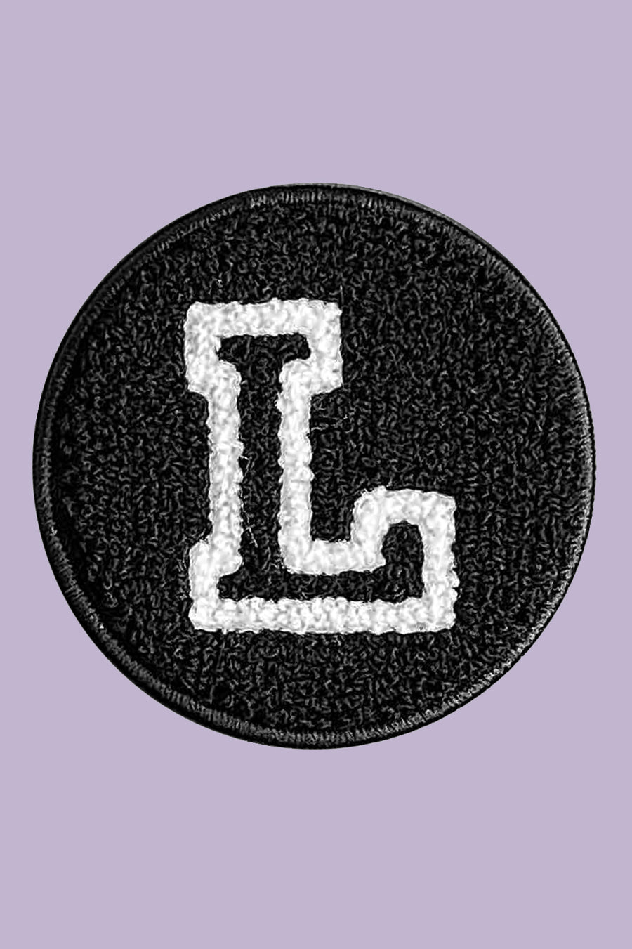 Black patch with a white letter 'L' on a purple background