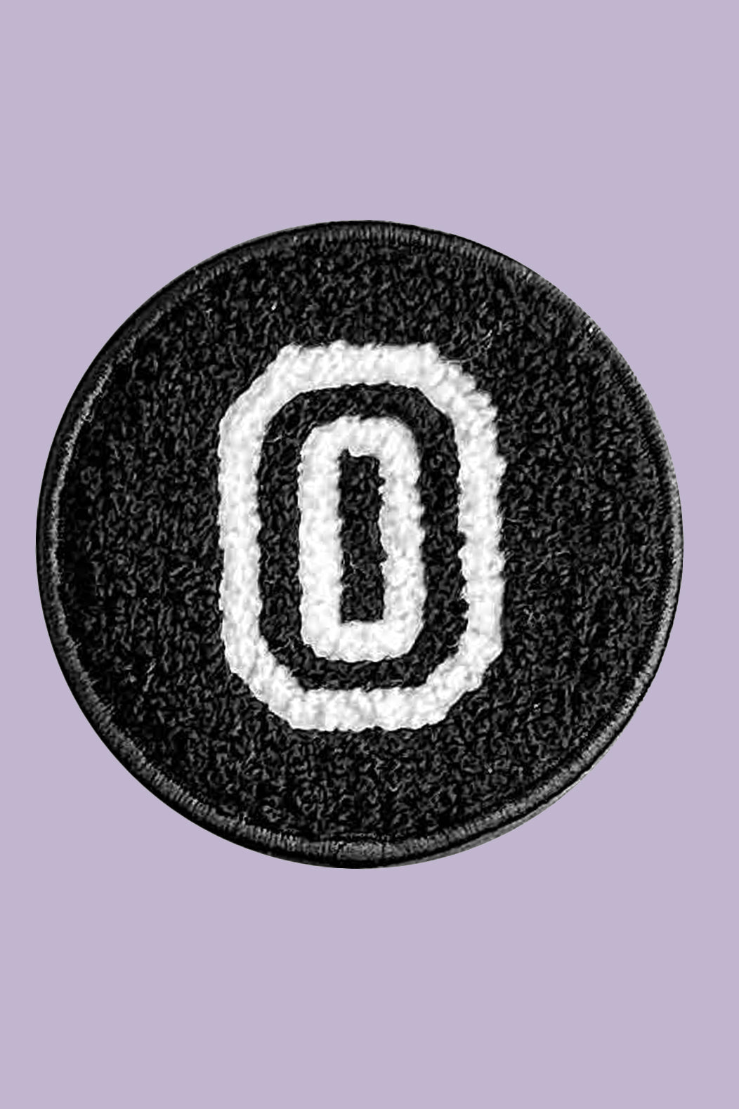 Black patch with white letter 'O' on a purple background