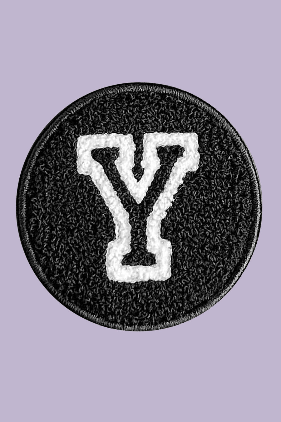 Black patch with white letter 'Y' on a purple background