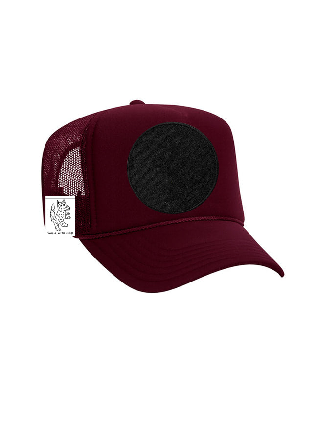 Maroon trucker cap with a black patch on a white background