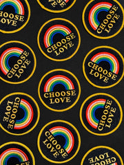 Pattern of rainbow and 'Choose Love' patches on a black background