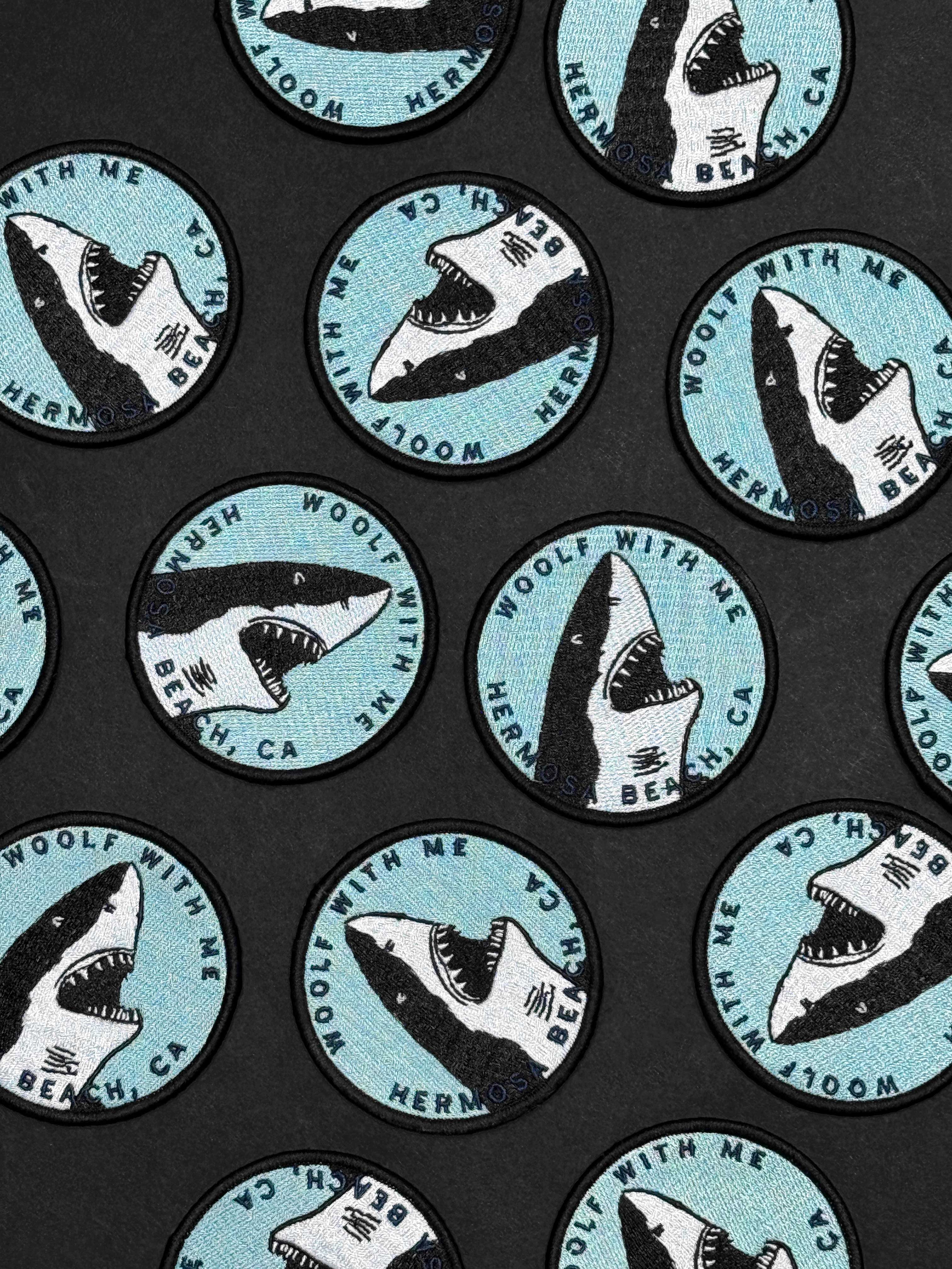 Pattern of shark illustrations with text on a black background