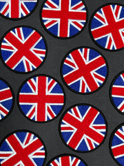 Pattern of British flags on a black background