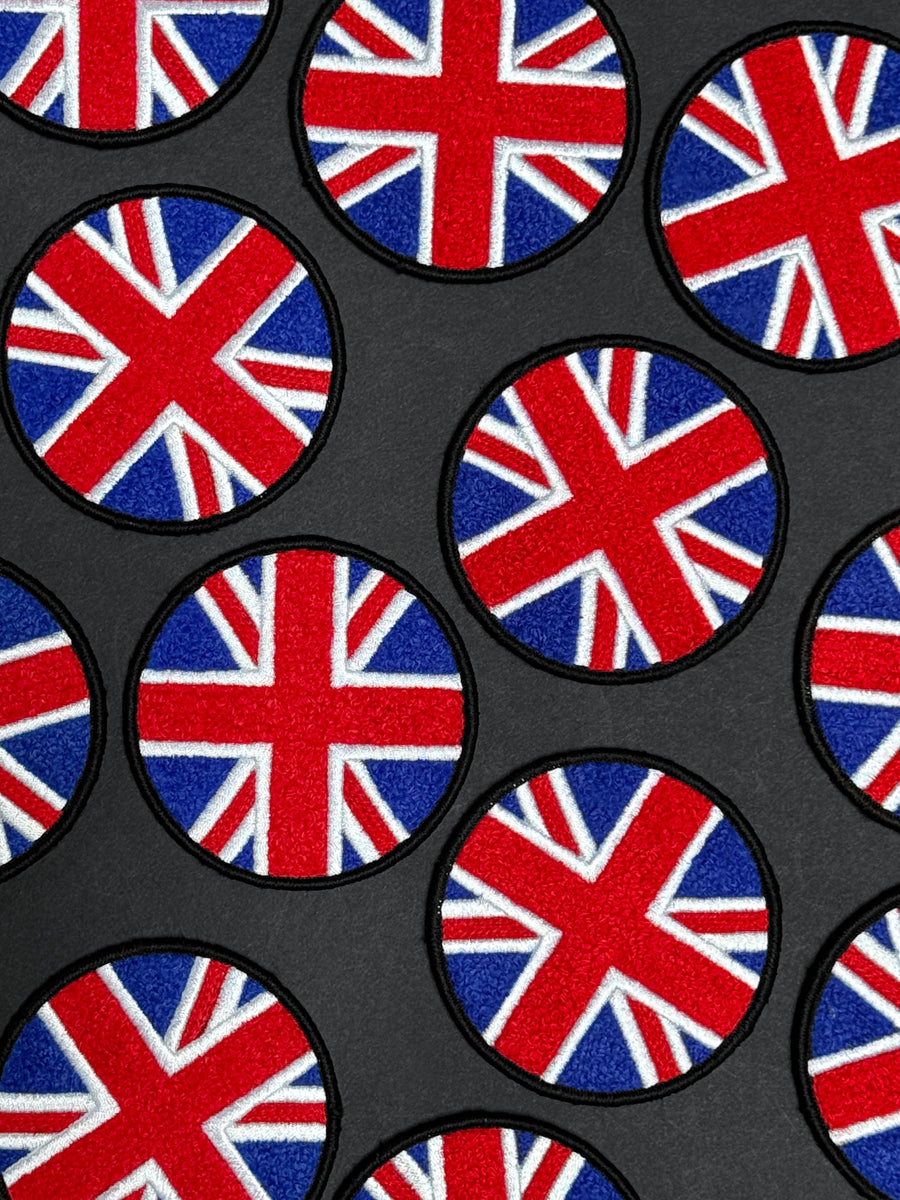 Pattern of British flags on a black background