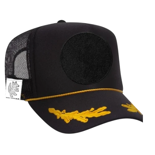 Woolf With Me® black adult trucker hat with gold rope trim, embroidered visor detail, and velcro patch area.