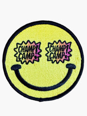 Woolf With Me® round yellow embroidered smiley face patch with Champ Camp text in star-shaped sunglasses