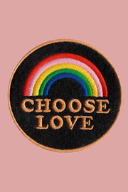 A round velcro patch with the text 'CHOSE LOVE' embroidered in multiple colors on a black background.