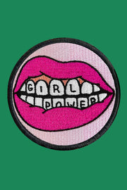 Patch with pink lips and 'Girl Power' text on a green background