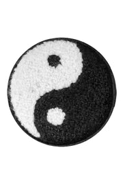 A round, embroidered patch with a Yin Yang symbol in black and white on a white background, designed for use on hats or bandanas.